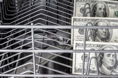 $100 bills inside of a dishwasher 