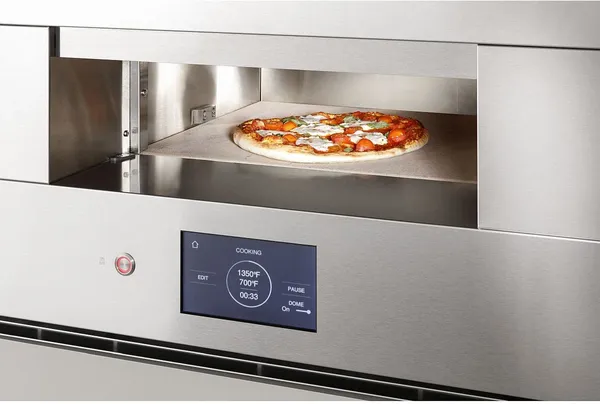 A close-up of a pizza baking inside the Monogram ZEP30FRSS oven 
