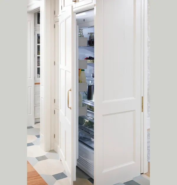 The Monogram ZIR361NBRII refrigerator with a custom white panel front 