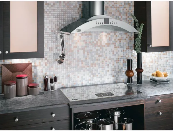 The Monogram ZV750SPSS range hood in a designer kitchen 