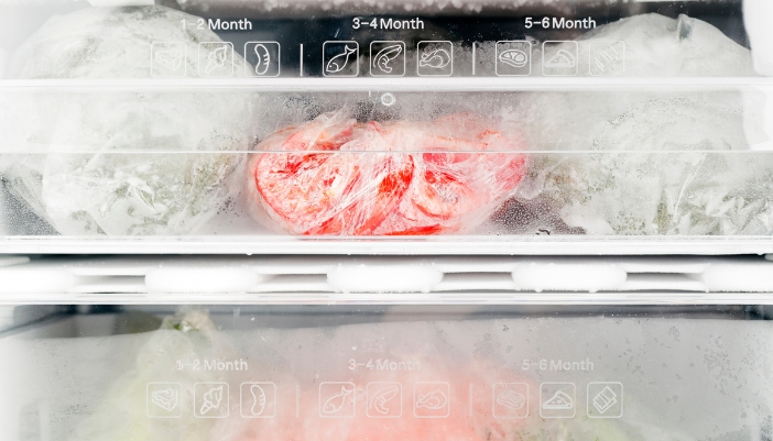 Closeup of freezer drawers with expected freshness dates on each shelf