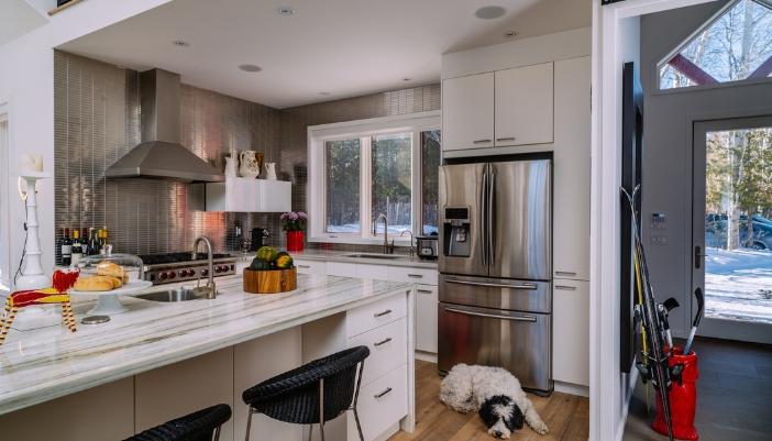 A home in winter showing the refrigerator in the kitchen