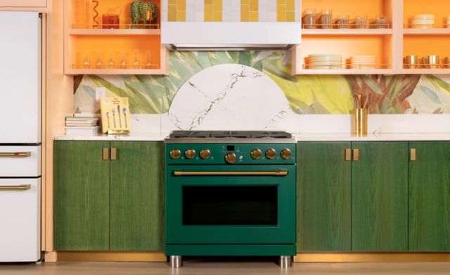 front view of a bright modern luxury kitchen with the Emerald Green cafe range