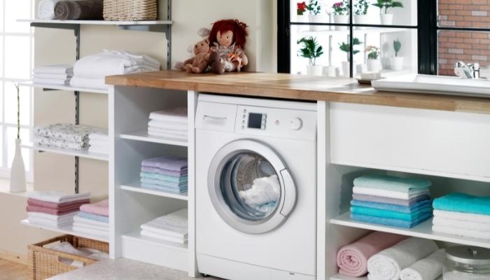 Laundry space with built-in counter on top of machines