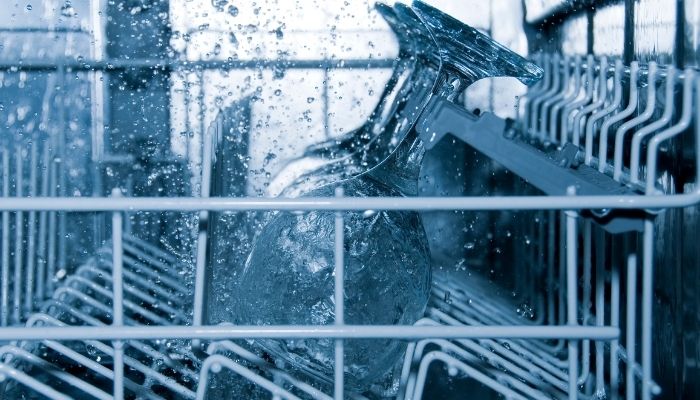 glasses being washed in a dishwasher