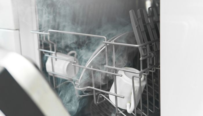 open dishwasher with steam coming out