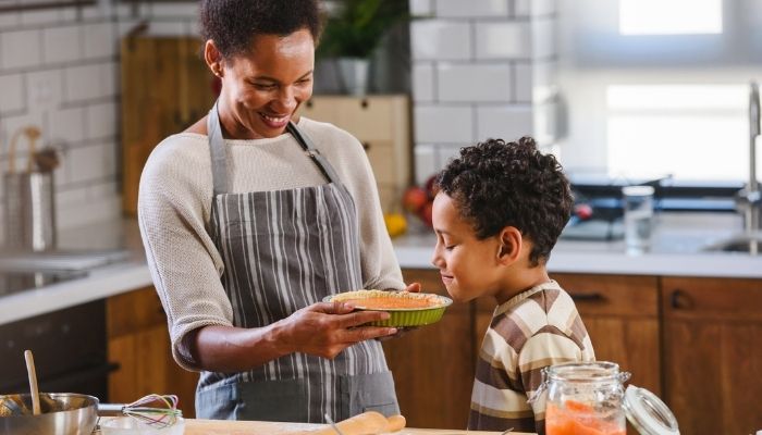 Mother and son baking a pie