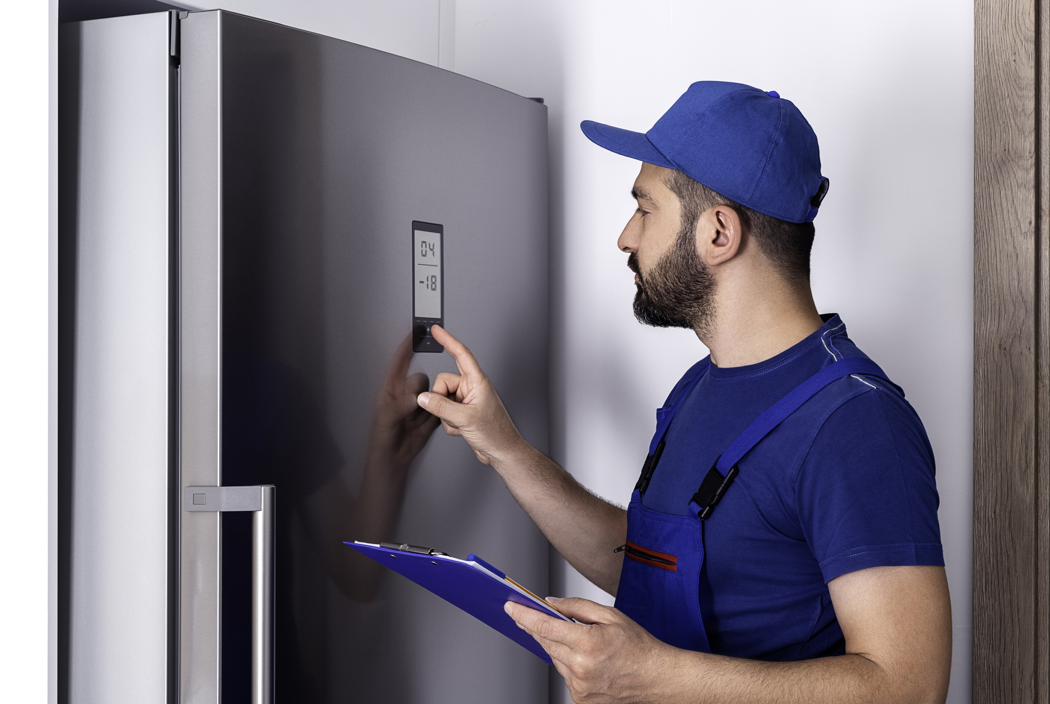 Looking at Refrigerator for Repair