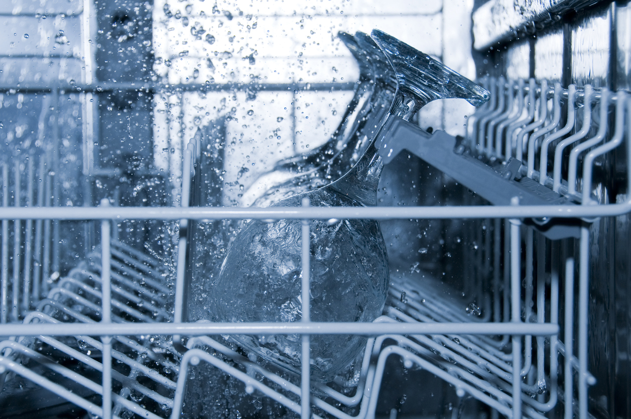 inside of a running dishwasher with glasses in it