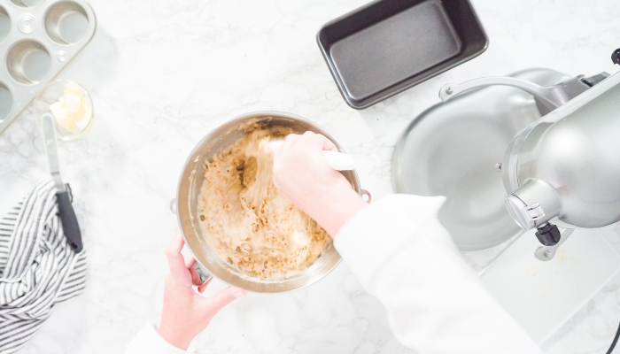 Closeup of person mixing ingredients in a bowl