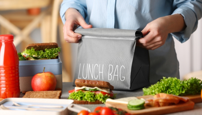Packing sandwiches in containers to go into a lunch bag