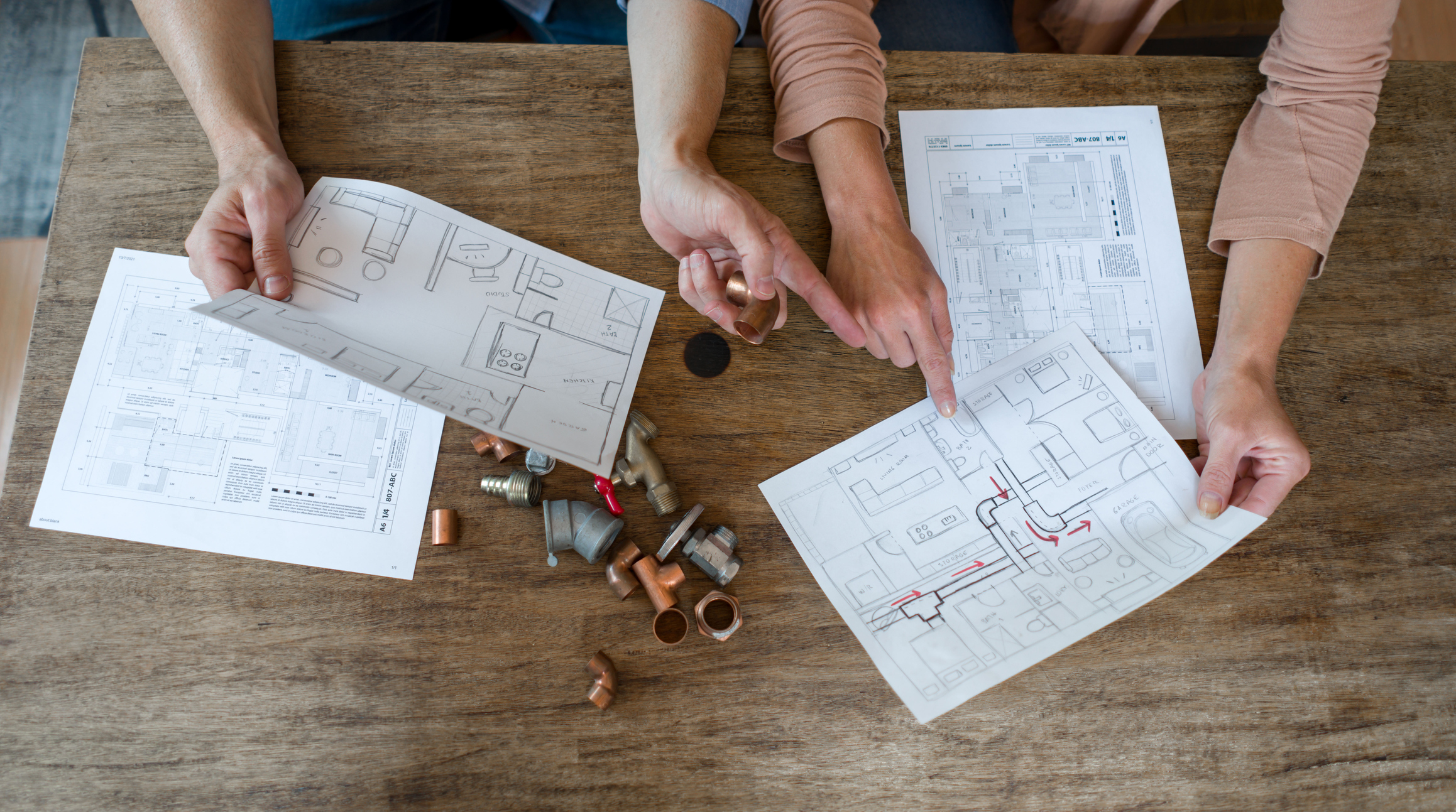 people planning kitchen remodel with remodel diagram