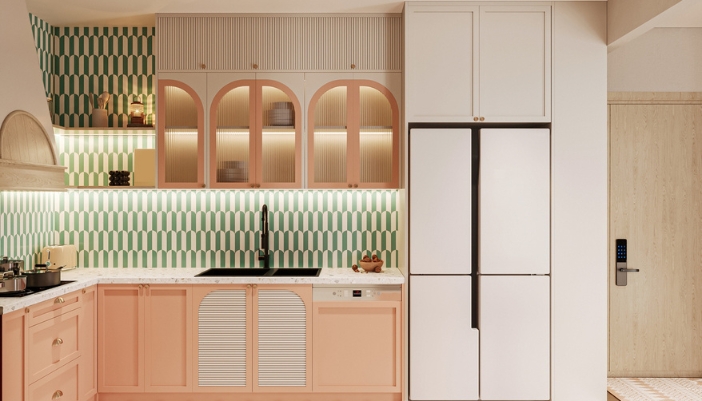 A modern but retro inspired kitchen with rounded cabinets and pastel, warm coloring.