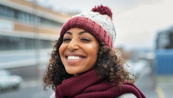 Woman wearing wool-knit cap and scarf