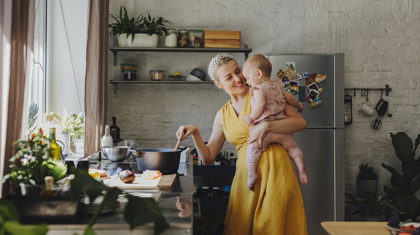 woman and baby in GE Profile appliance kitchen