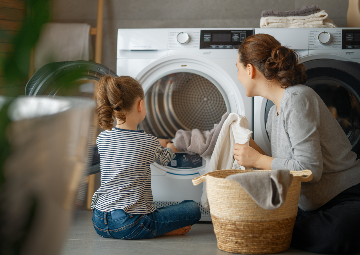 Mom and daughter doing laundry