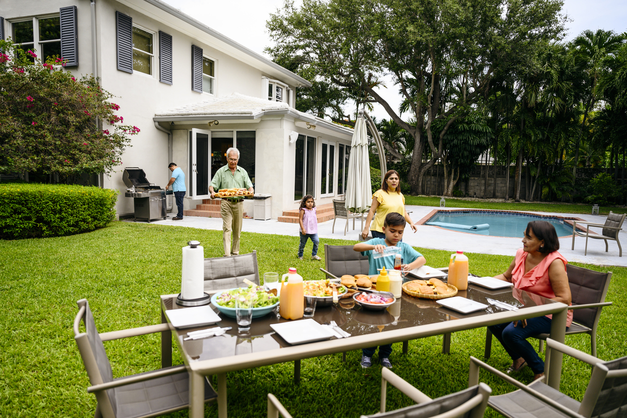 family with backyard furniture