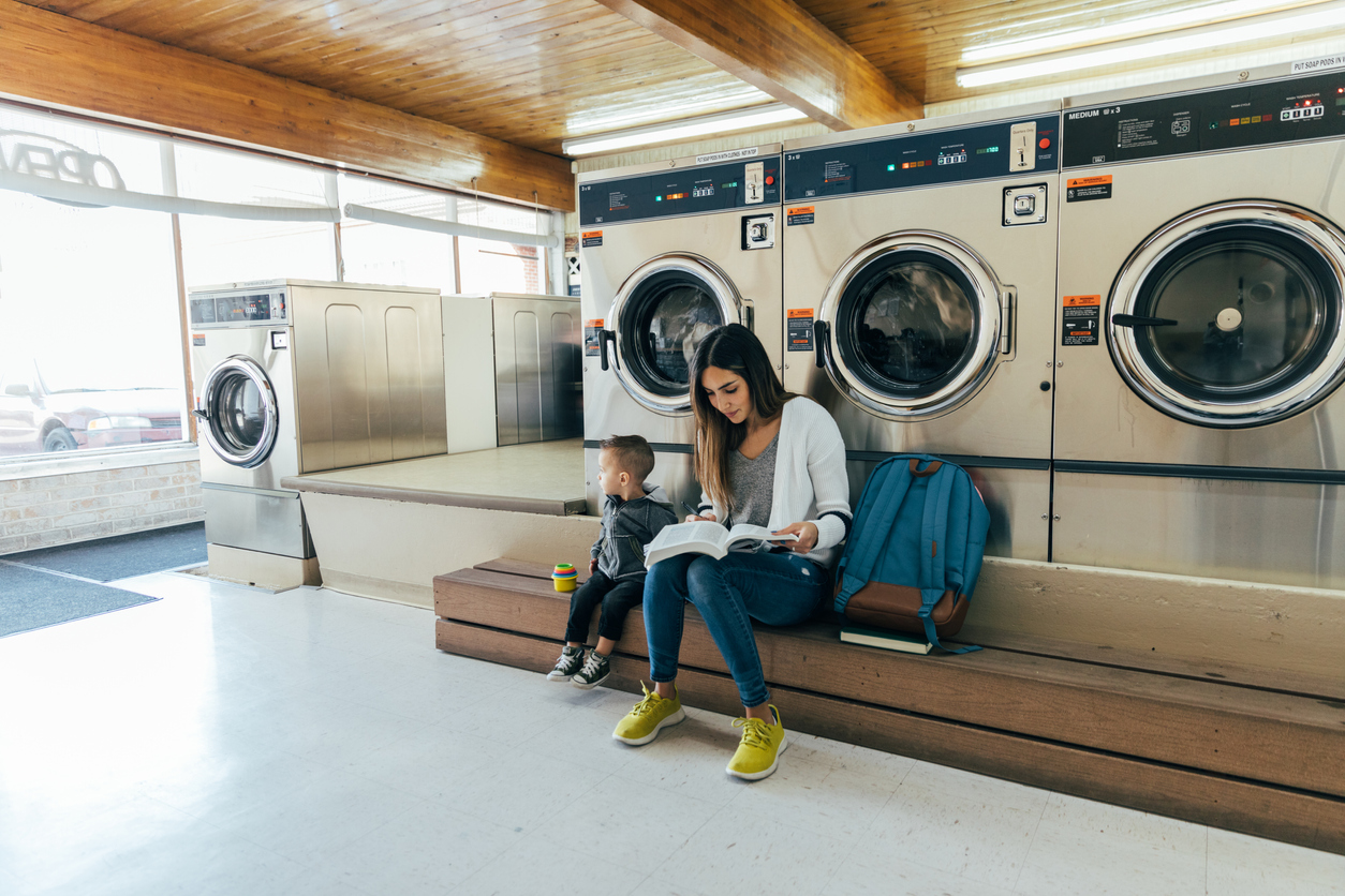 Woman and kid in laundromat