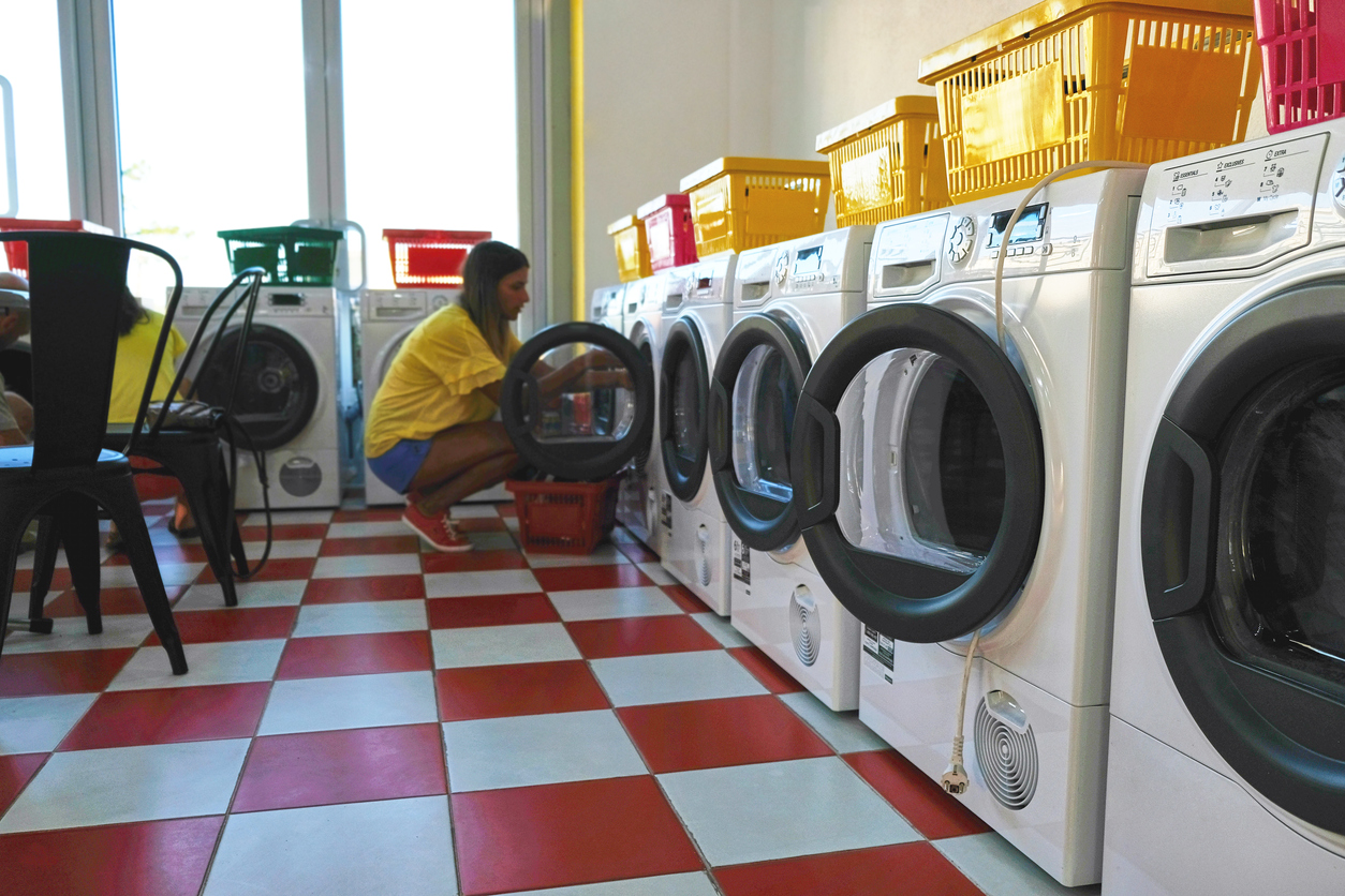 Woman in checkered laundromat