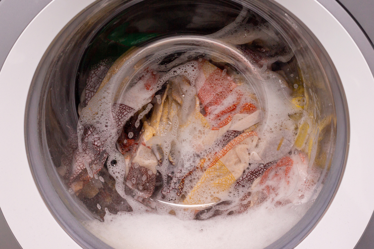 wet and soapy clothes in machine 