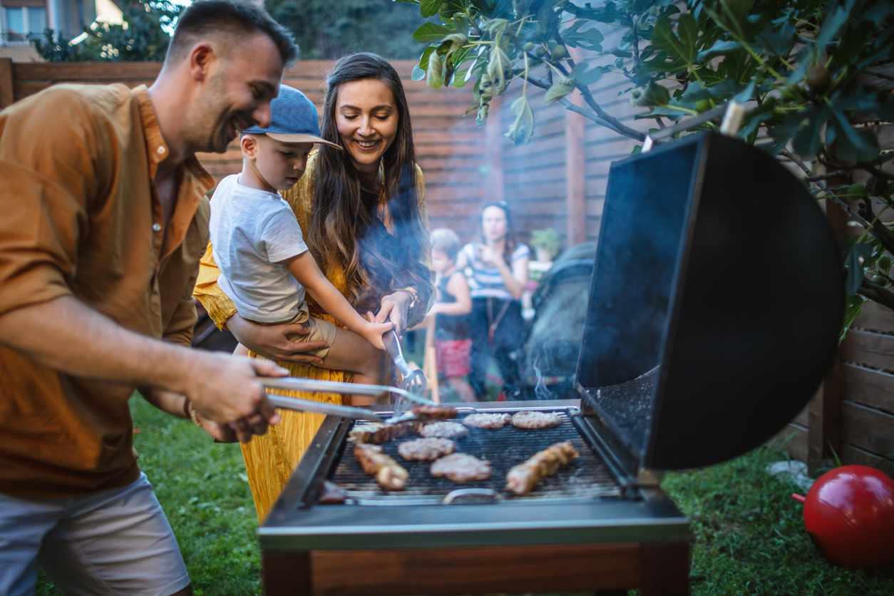 Family grilling outside