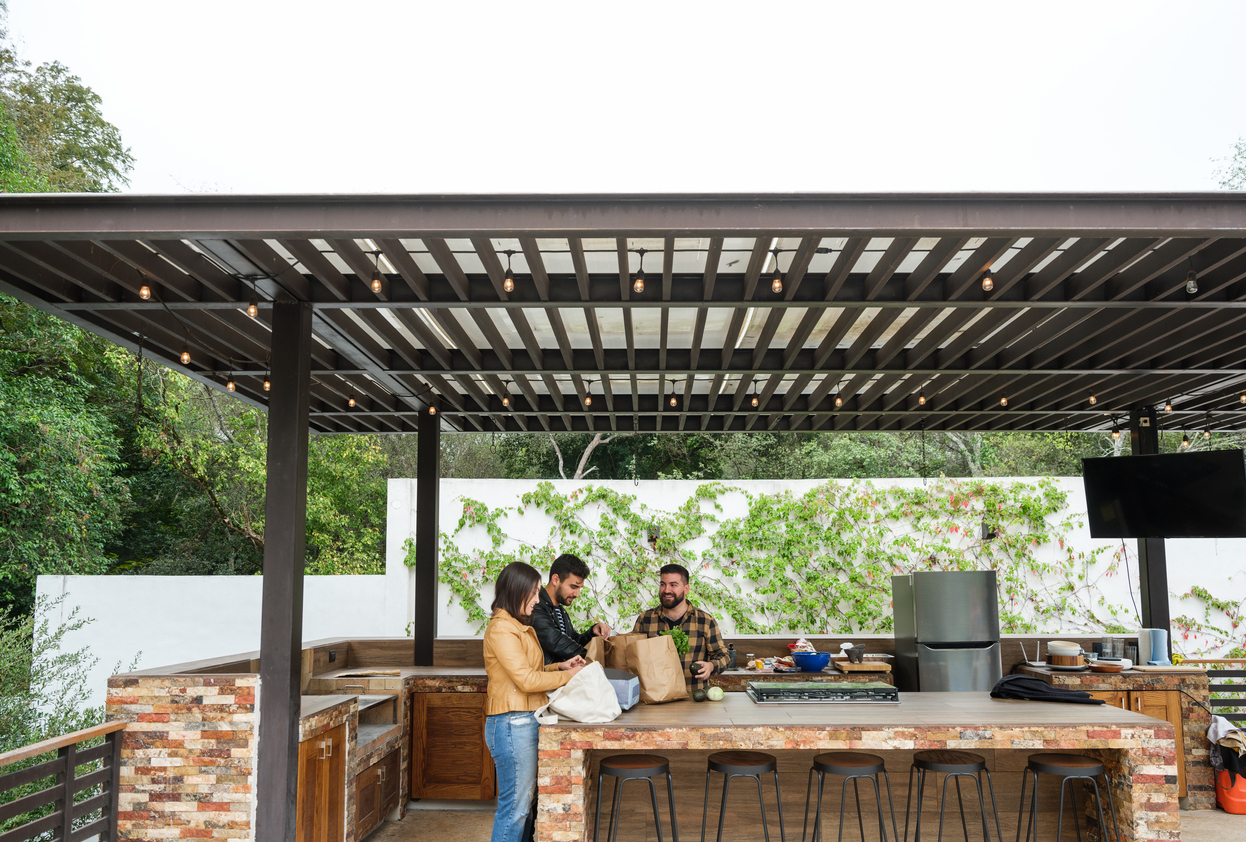 friends unpacking in their outdoor kitchen