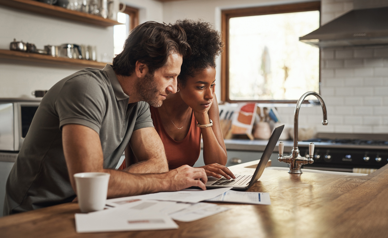 Couple Looking at Scratch & Dent Appliance Online