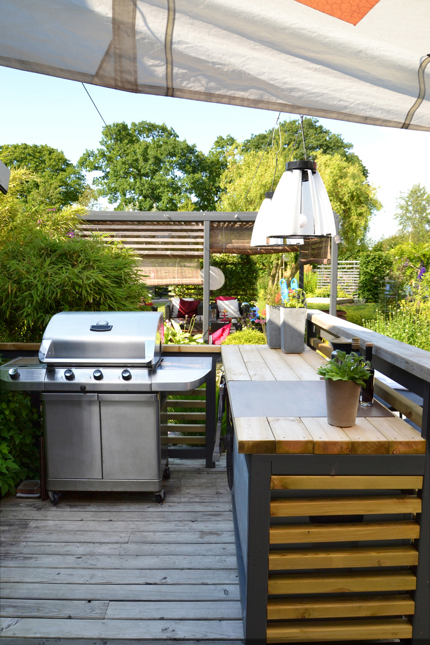 small outdoor kitchen with gas grill
