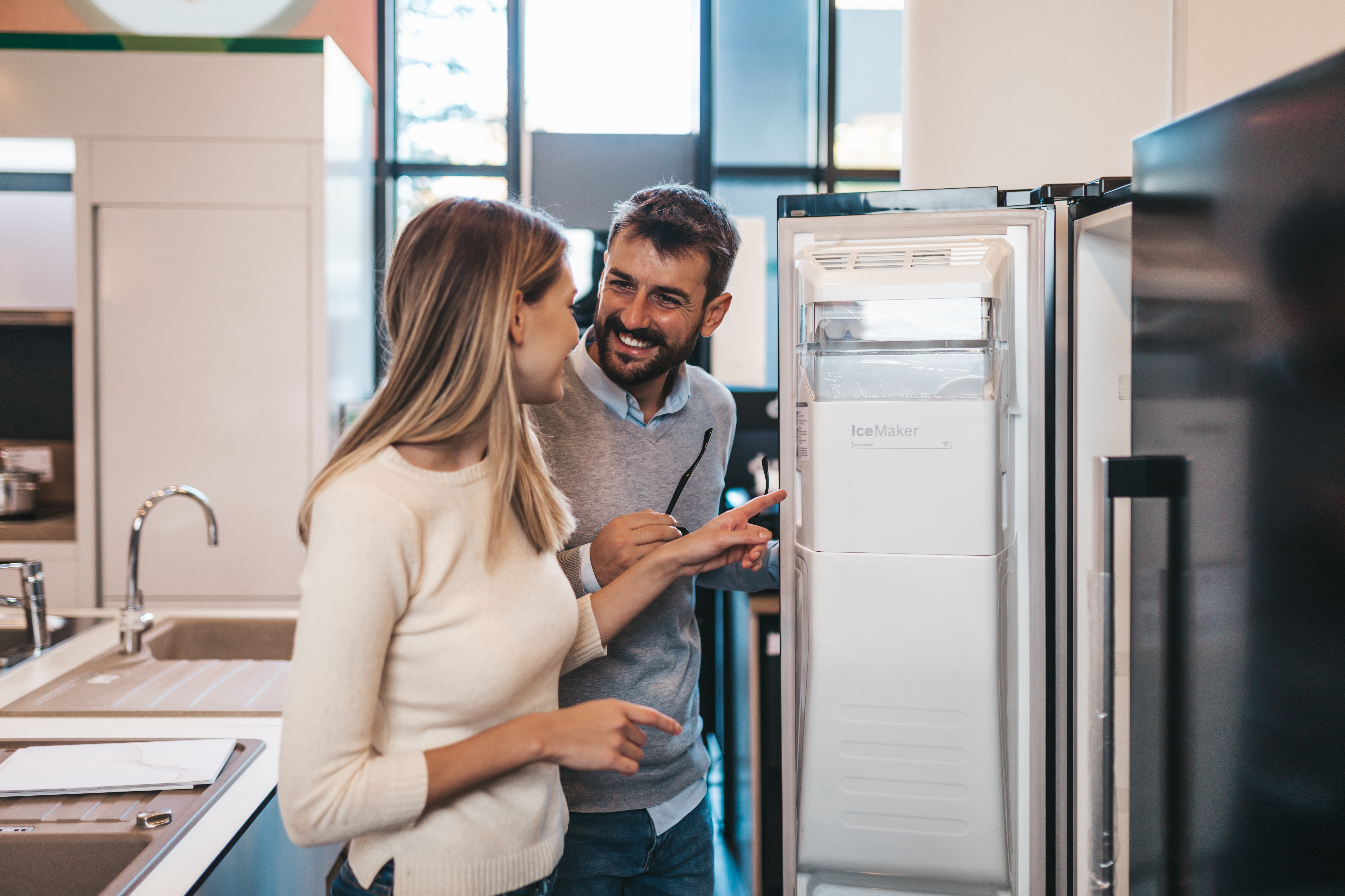 a couple buying new appliances