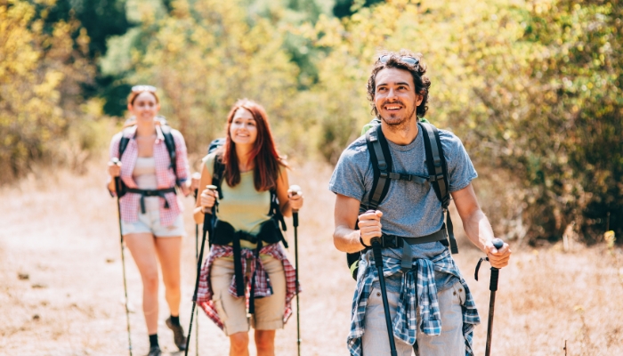 Group of friends hiking in base layers