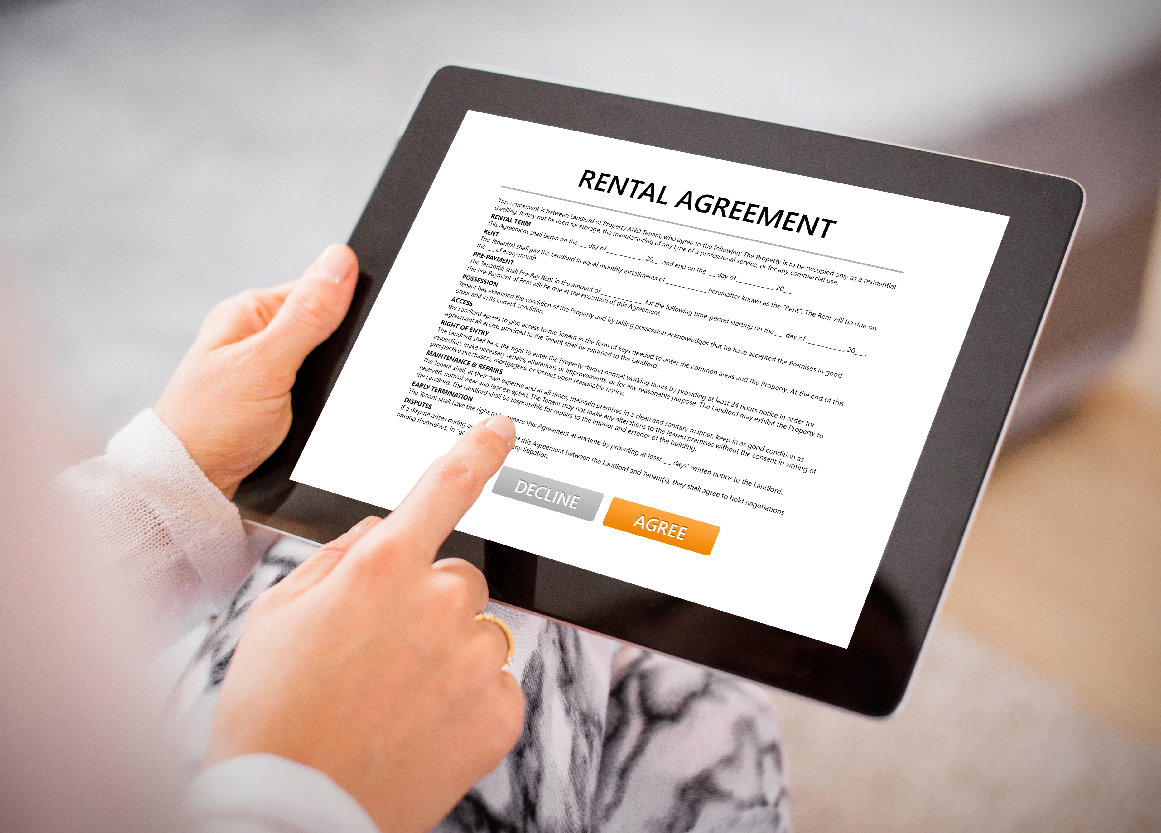 person reading over rental agreement 