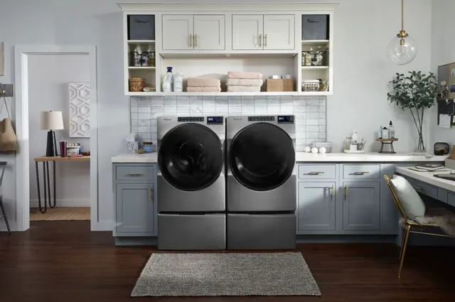 whrilpool washer and dryer in light blue laundry room