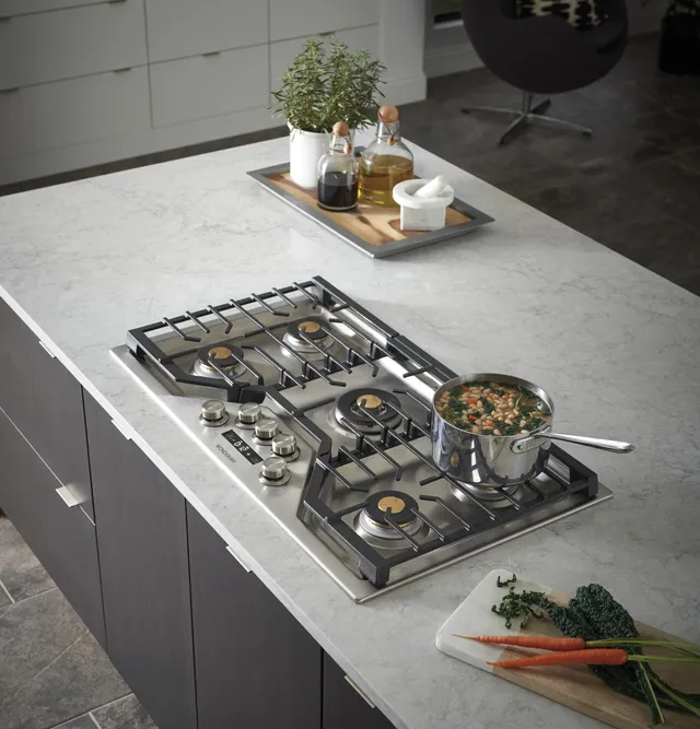 ge mongram gas cooktop in modern kitchen island
