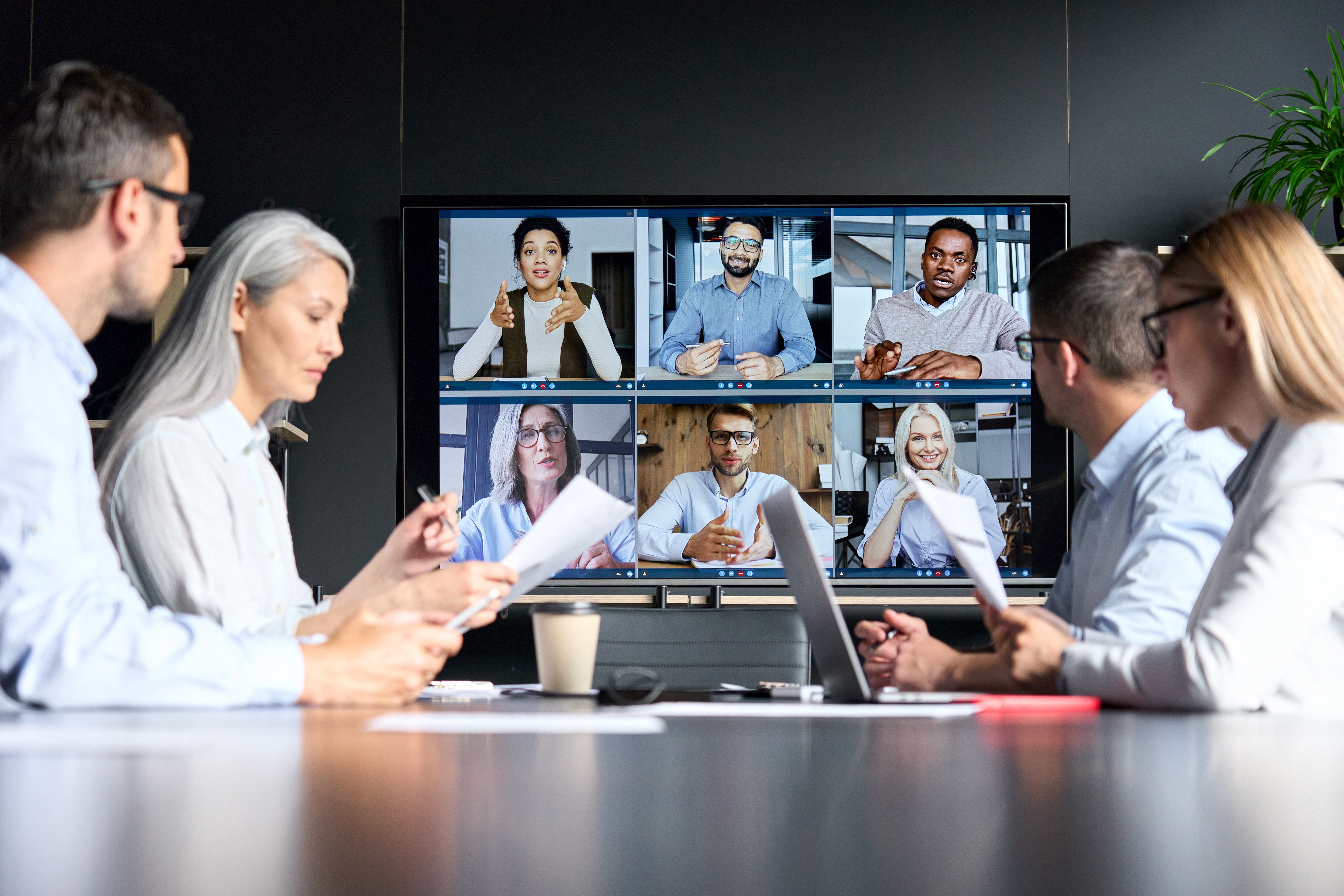 people working in a conference room 