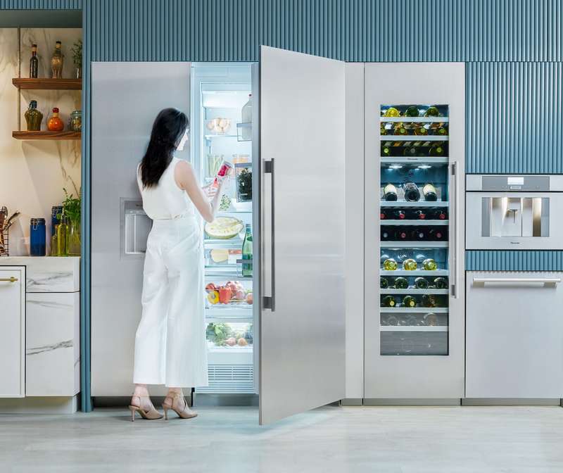 thremador french door refrigerator with woman opening it