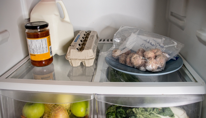 Frozen meatballs thawing in the fridge