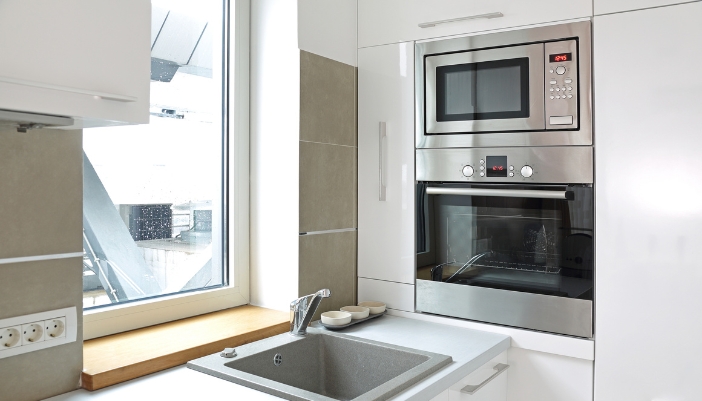 A closeup of a microwave oven combo in a kitchen