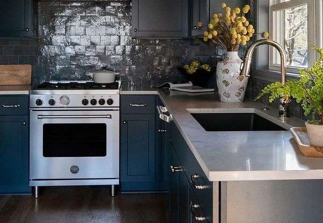 front view of a bertazzoni range in a modern rustic kitchen 