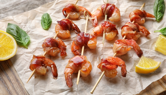 Tray of bacon-wrapped shrimp.
