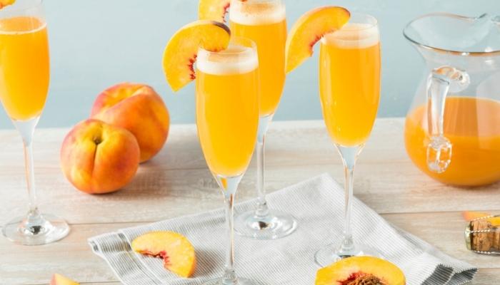 peach drinks on table with pitcher