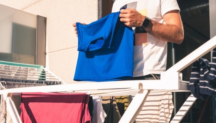 Man hanging clothes out to dry