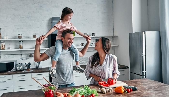 Happy family cooking in kitchen
