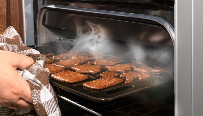baked treats getting pulled out of oven