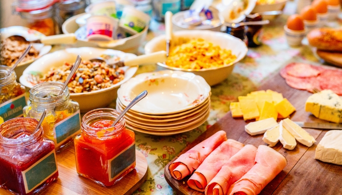 Breakfast station spread with jams, jellies, and other foods