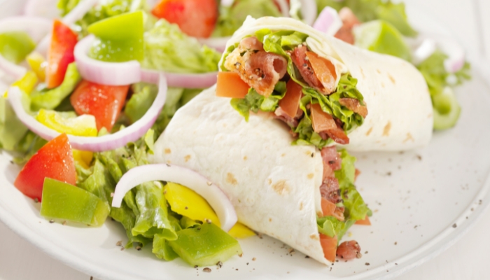 Plate with BLT wraps and a salad