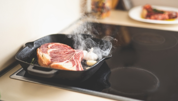 Steak grilling on the stovetop