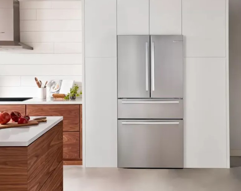 bosch counter depth refrigerator in a minimal white kitchen