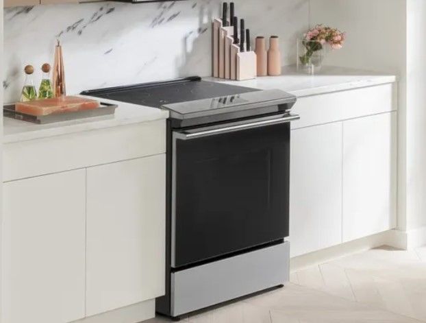 view of an induction range in a modern white kitchen