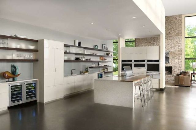 front view of a modern kitchen with a cream white panel ready french door refrigerator 