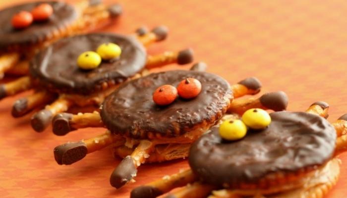 spider crackers on an orange tablecloth